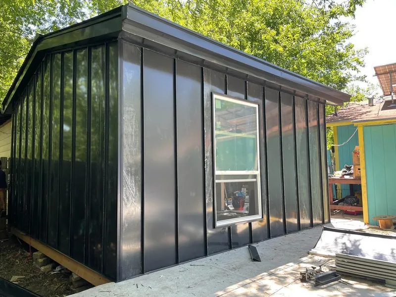 Black standing seam metal wall panels for Metal Roof Installation in Houlton